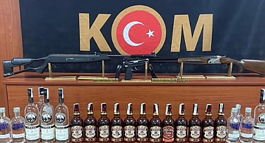 Sahte içki ve silah ele geçirildi