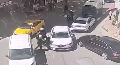 Sürücüsünün 'Dur' ihtarına uymadığı otomobilin çarptığı polis yaralandı; olay kamerada