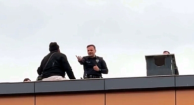 Çatıya çıkan kapıcıyı, başkomiser ikna etti